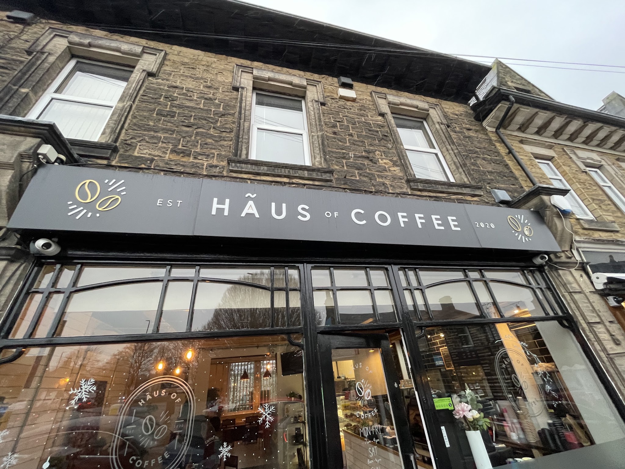 Hãus of Coffee shopfront on Station Road with its black and gold fascia